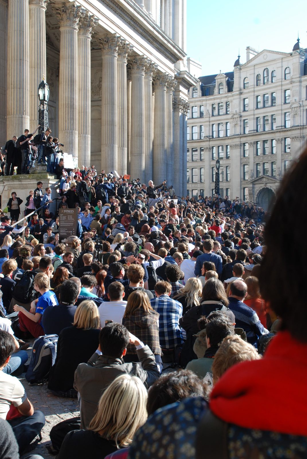 The question asked out loud. Julian Assange speaks at Occupy London outside St Paul's Cathedral, October 2011. Source: Ilias Bartolini, Wikimedia Commons.